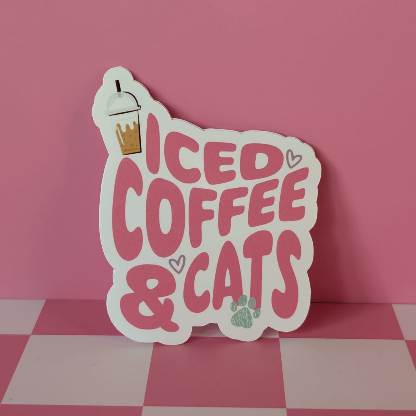 Sticker with 'ICED COFFEE & CATS' text on a pink background