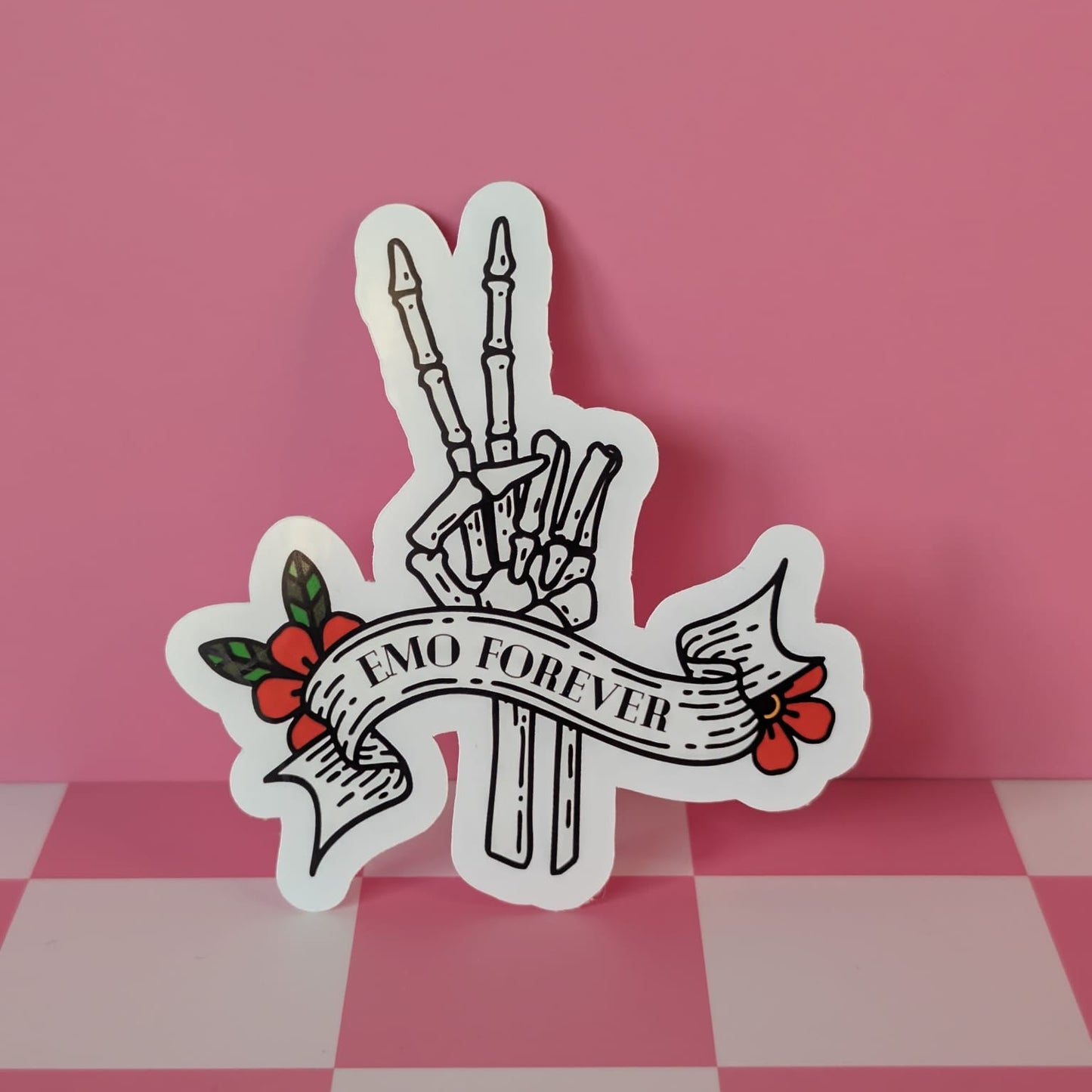 Sticker with skeleton hand peace sign and 'Emo Forever' text on a pink and white checkered background