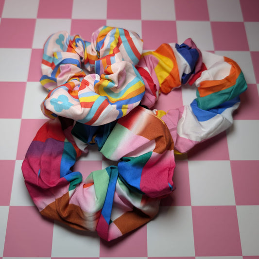 Colorful scrunchies on a pink and white checkered background