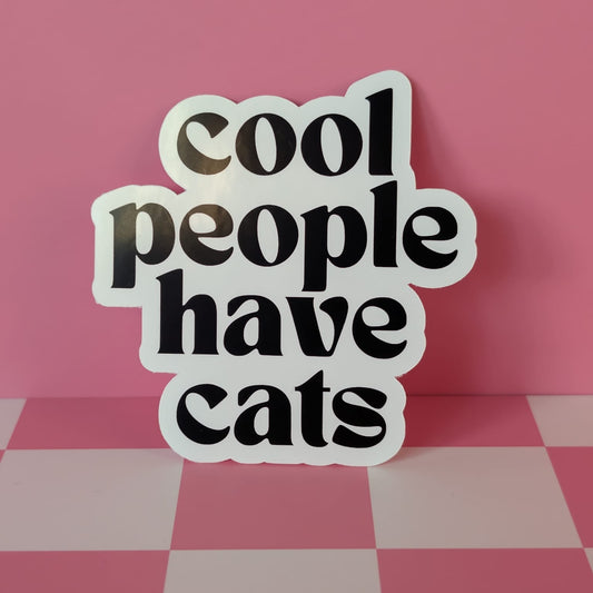 Sticker with 'cool people have cats' text on a pink checkered background