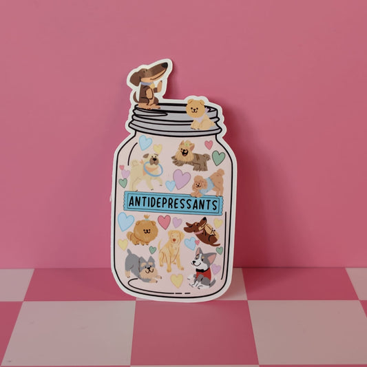 Sticker of a jar labeled 'Antidepressants' with cartoon bear illustrations on a pink background.