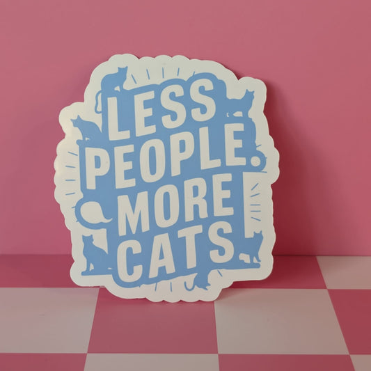 Sticker with 'LESS PEOPLE MORE CATS' text on a pink and gray checkered floor.