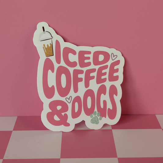 Sticker with 'ICED COFFEE & DOGS' text on a pink background