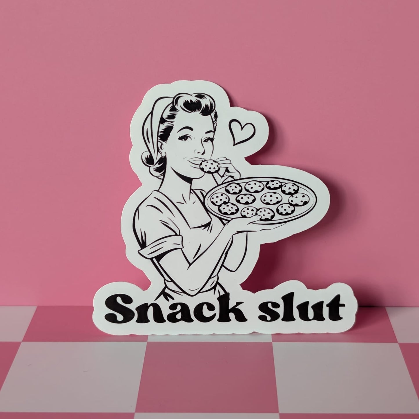 Sticker of a woman holding a pizza with 'Snack Slut' text on a pink checkered background