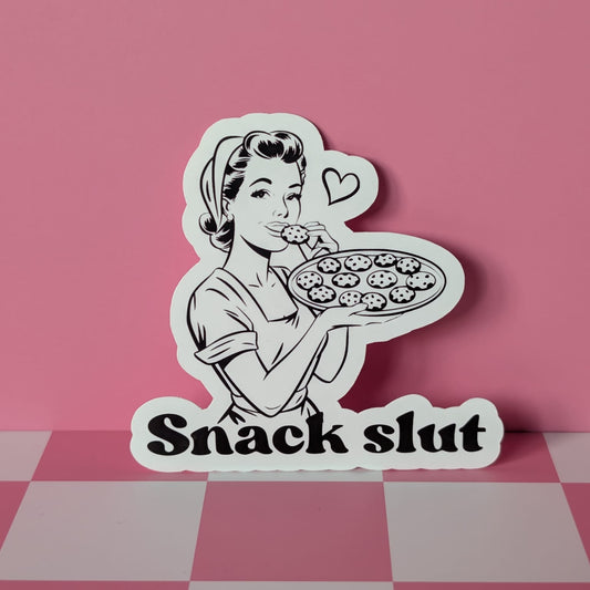 Sticker of a woman holding a pizza with 'Snack Slut' text on a pink checkered background