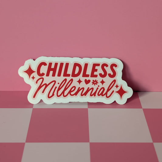 Sticker with 'CHILDLESS Millennial' text on a pink and gray checkered surface